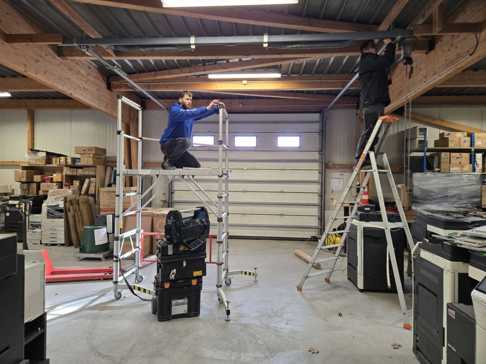 Réparation des ressorts d'une porte sectionnelle industrielle