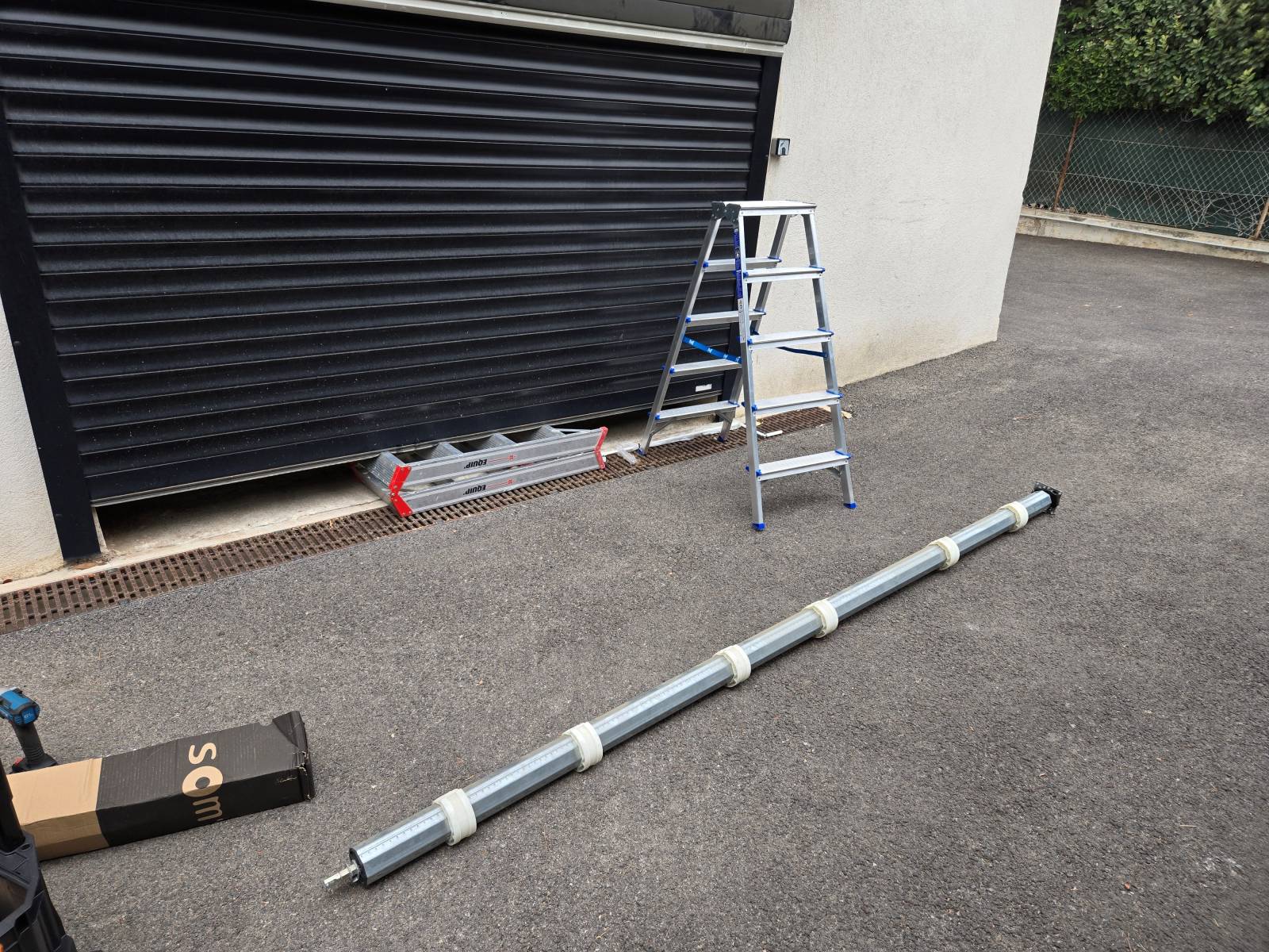 Dépose d'axe d'une porte de garage enroulable